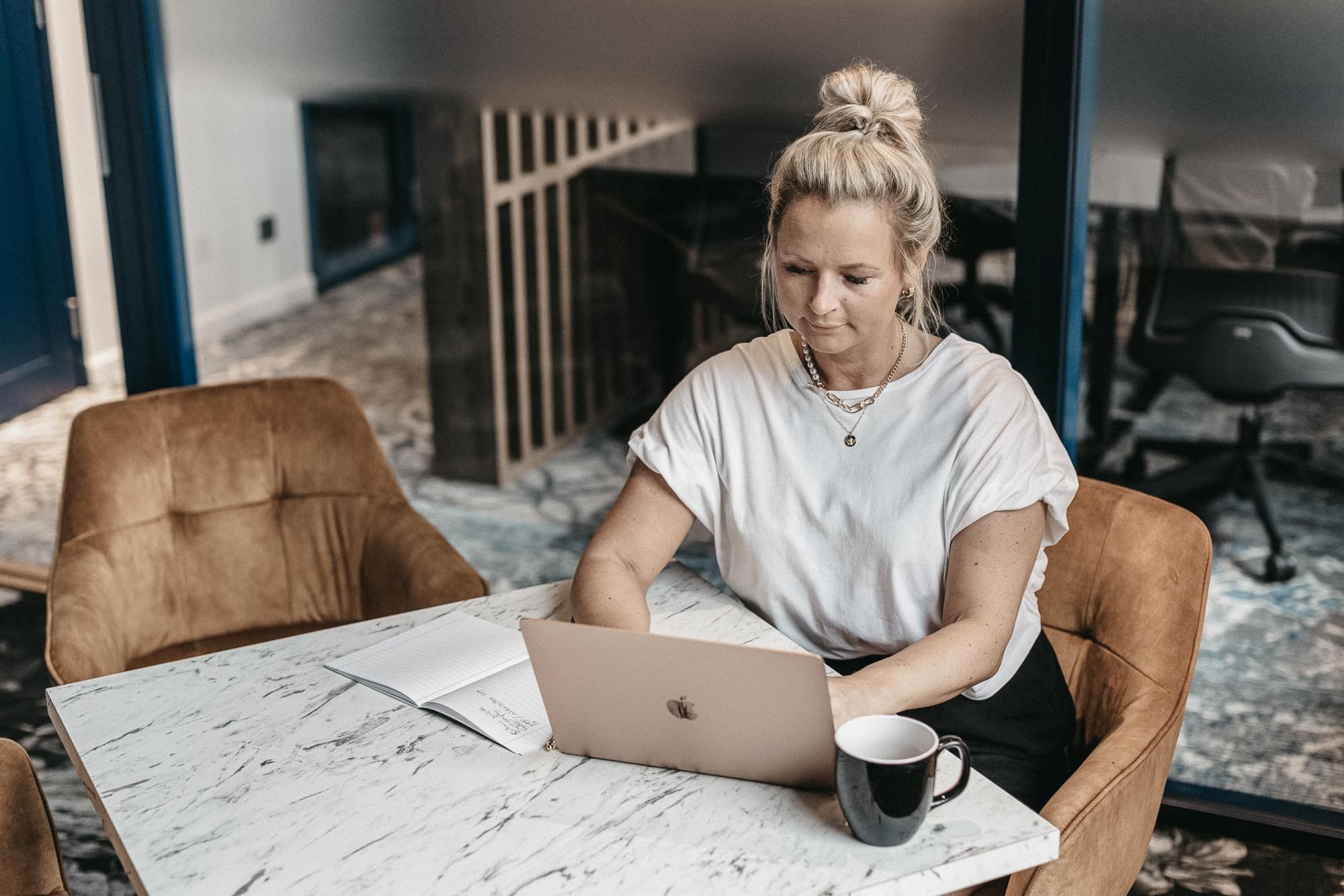 Woman working on a laptop on different residual income ideas